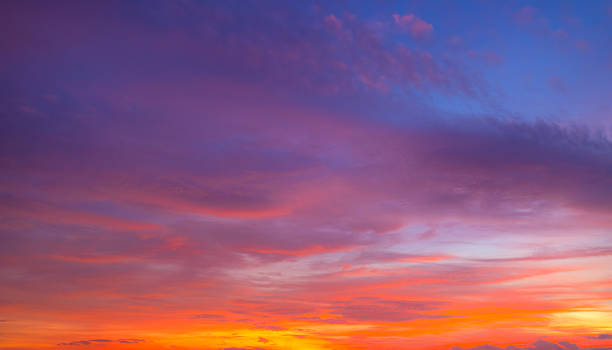 istock Vibrant Twilight Sky with Dramatic Purple and Orange Sunset Clouds 2259866874