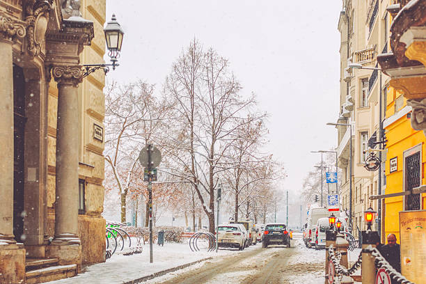 City traffic streets in winter colors - purple sky, yellow moon.