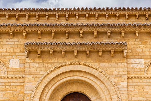 Ornate corbels and arch detail on the 11th century San Martin de Fromista church facade