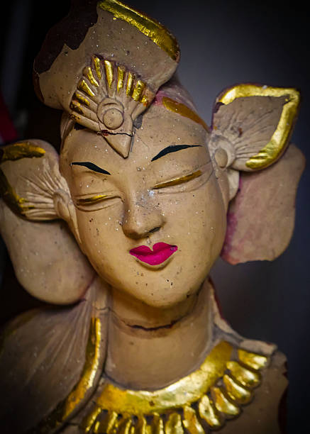 serene Bali dancer ceramic bust featuring closed eyes, bright lips, and gold embellishments. Ideal decorative sculpture for home, temple, or gallery displays, emphasizing art, culture, and craft.