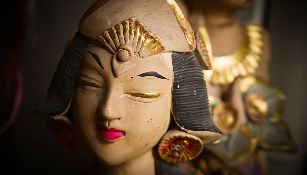 serene Bali dancer ceramic bust featuring closed eyes, bright lips, and gold embellishments. Ideal decorative sculpture for home, temple, or gallery displays, emphasizing art, culture, and craft.