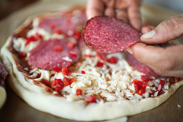 Man making pizza at home