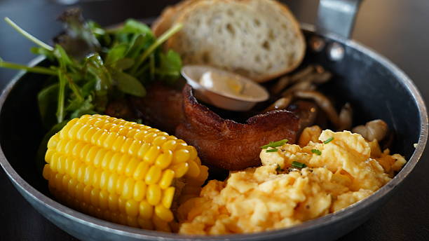 Hearty Brunch Skillet with Eggs, Bacon, Corn  Greens