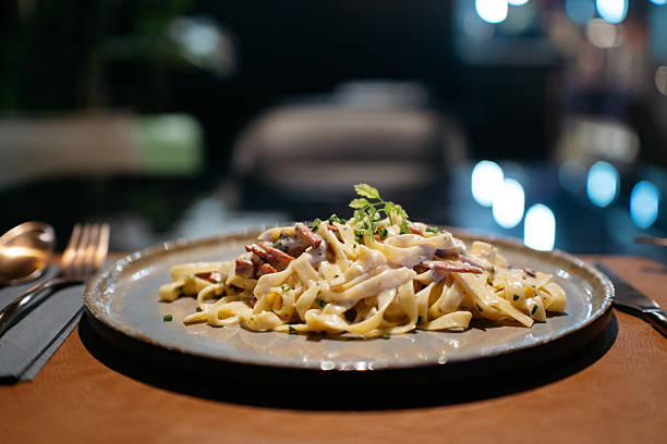 Gourmet Fettuccine Carbonara with Crispy Guanciale in Upscale Restaurant