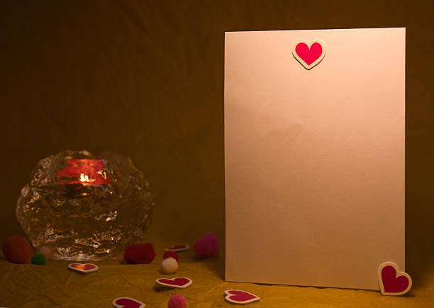 A collection of blank white cards arranged vertically on red and gold backgrounds. Decorated with heart-shaped wooden clips and stickers. Includes pom-poms and candlelight details. A perfect template with blank space for romantic messages.