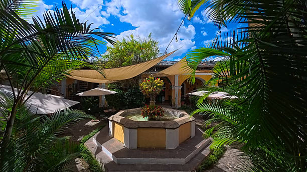 Antigua, Guatemala - November 25, 2025 - Ancient patio with tropical plants