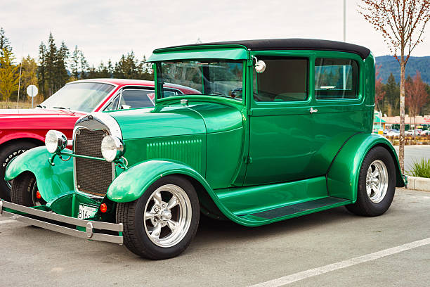 A Ford Model A hot rod is parked in a parking lot in Port Alberni, British Columbia, Canada, on an overcast day.