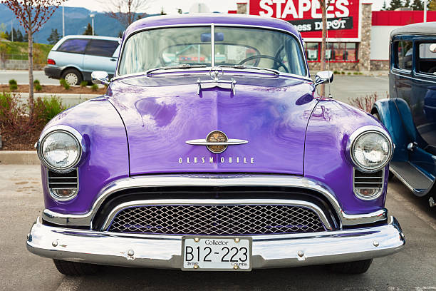 A 1950 Oldsmobile 88 is parked in a parking lot in Port Alberni, British Columbia, Canada, on an overcast day.