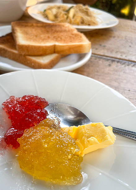 Toast bread with marmalade and strawberry jam breakfast