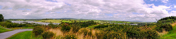 A sweeping vista from Concra showcasing the rolling green drumlins of Monaghan and the expansive, serene waters of Lough Muckno near Castleblayney.
