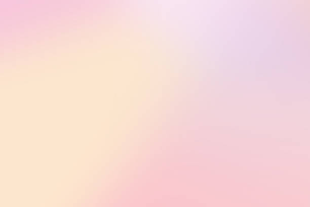 istock Blurry abstract background featuring a soft gradient of pastel pink, peach, and violet 2259932218