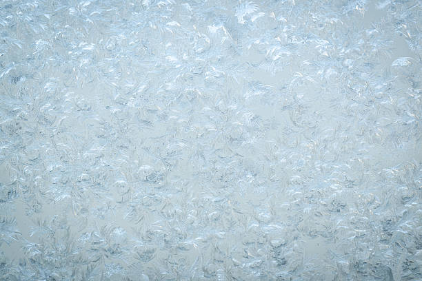 Beautiful frosty window as background, closeup. Winter morning
