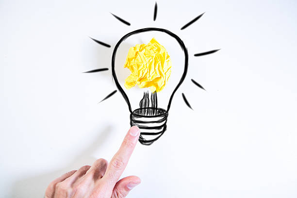 istock hand holding bulb with crumpled paper 2259943160