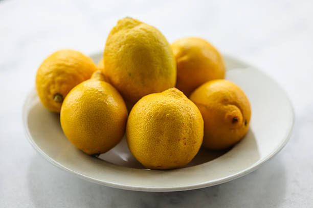 Fruits and vegetables. Lemon on a plate.