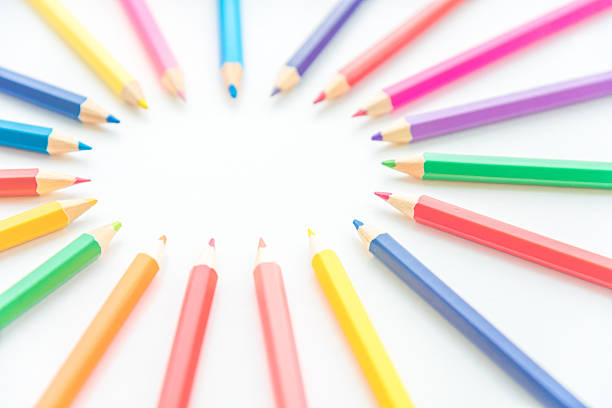 Multi colored pencils arranged according to the colors of the rainbow textured background horizontal shot