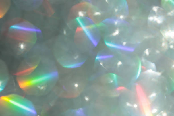 Shiny luxury glitter rainbow glow light flare with bokeh background