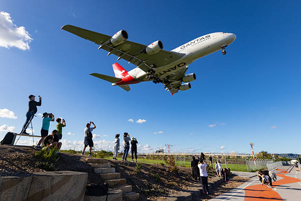 Qantas Airbus A380 with people watching it pass overhead