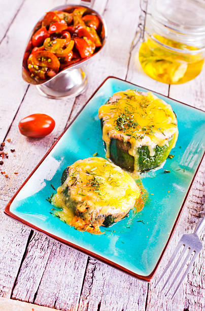 Zucchini stuffed with cheese and chicken