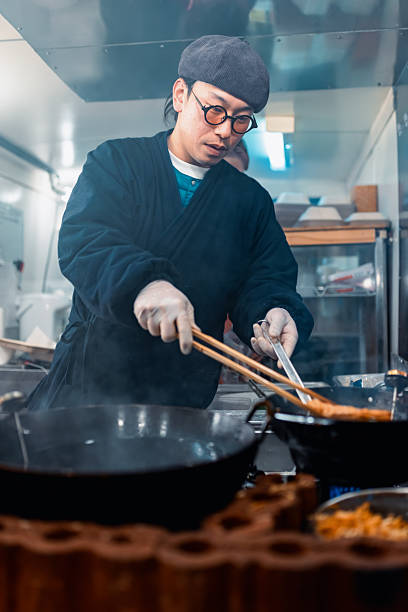 Chef in a food truck making Tempura