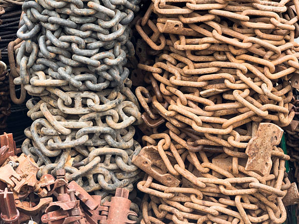 Old rusty anchor chains, large chain wrap, chains for sale at the market. High quality