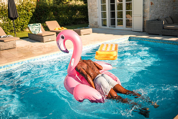 istock Black Male Enjoying Pool Party on a Floaty 2260017231