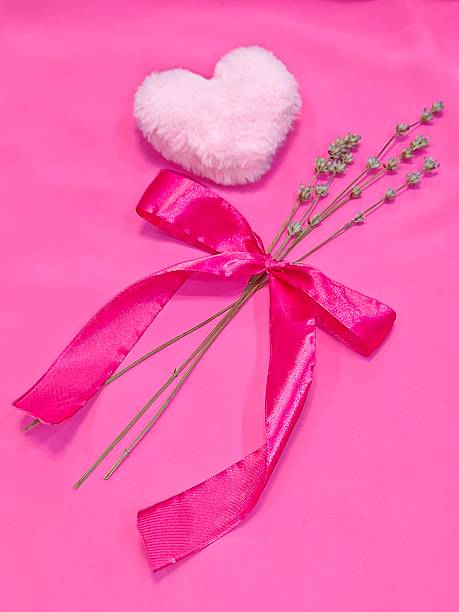 Fur heart on the pink background . High quality photo