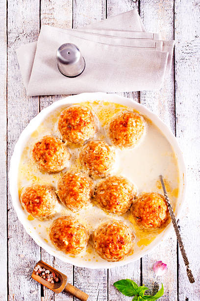 Baked meatballs with spices and white sauce