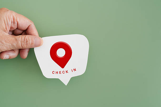 check in icon and text on real white speech bubble paper cut in hand on green background