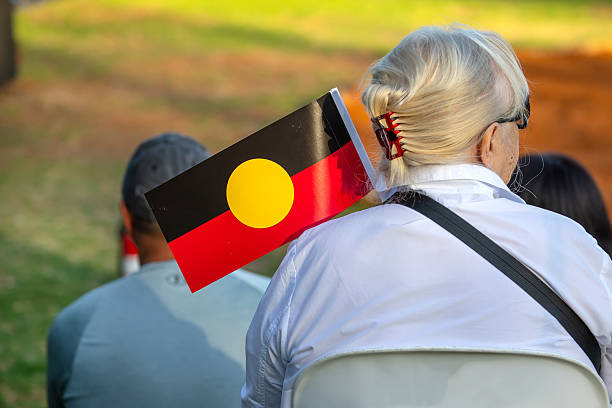 Australian aboriginal flag  at indigenous community ritual smoking ceremony rite