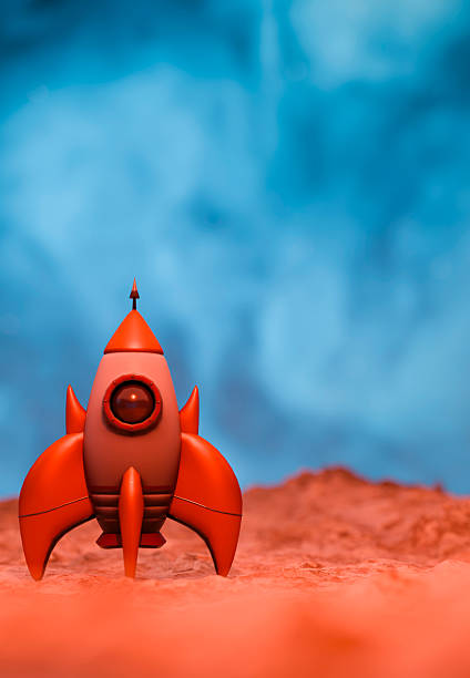 A stylized, vintage-inspired rocket stands ready for liftoff on a textured, orange-hued extraterrestrial surface beneath a swirling blue atmosphere