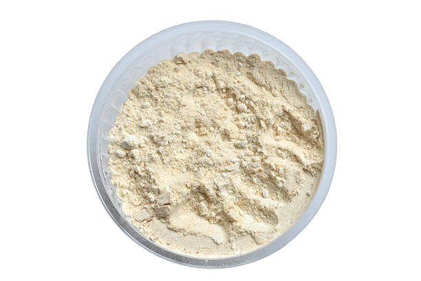 Spice for cooking, ground dry garlic, isolated on white background.