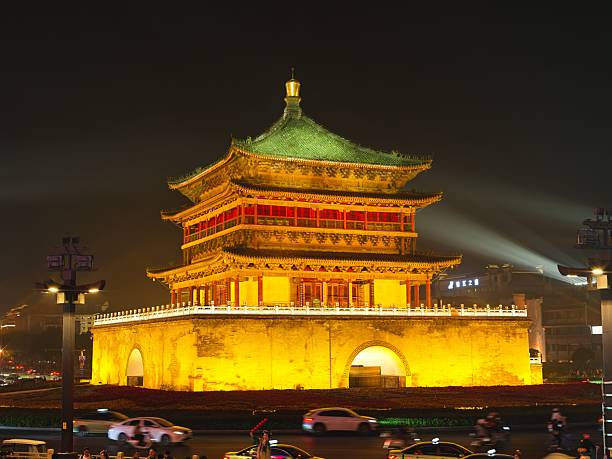 Xi'an, China - December 5, 2015: The Bell Tower illuminated at night, with traffic trails in foreground