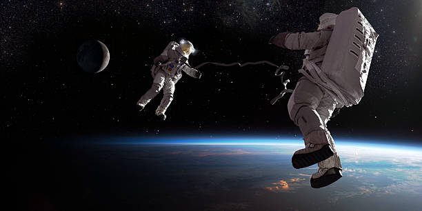 istock Astronauts In Spacewalk Over Earth 2260081068