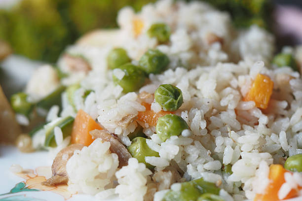 A vibrant mix of rice and vegetables arranged on a plate.