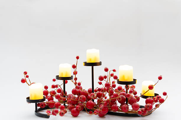 Small votive candles on a large candelabrum.
