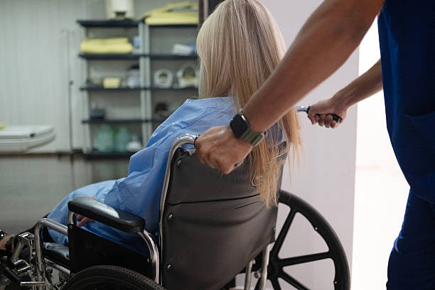 Smiling woman in wheelchair on white background