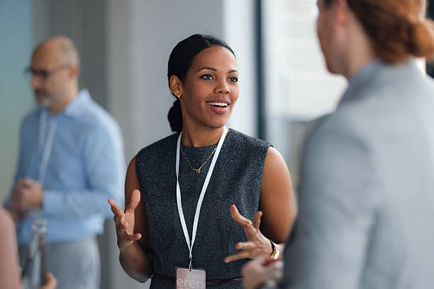 istock Confident Woman Speaker Engages Group During Professional Conference and Networking Breakout Discussion Session Today 2260129380