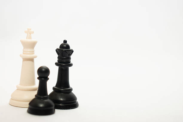 Conceptual image using chess pieces to represent social inequality, diversity, inclusion and power imbalance. Symbolic metaphor for leadership, discrimination, minority versus majority, social pressure and equality. Ideal for business, education, social campaigns, editorial content and awareness projects.