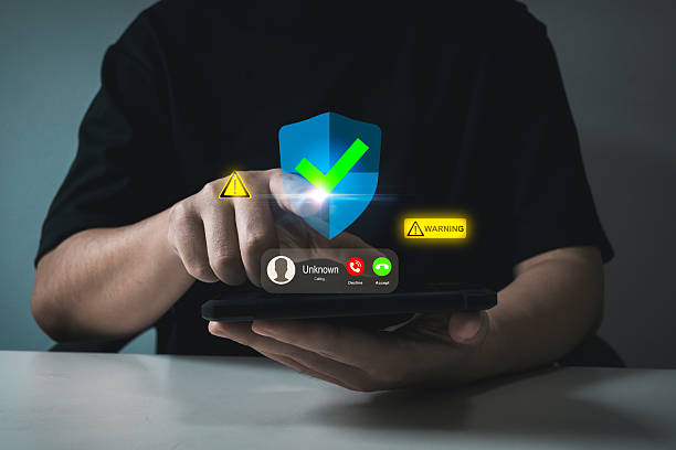 Scammer Alert. customer people holding mobile phone receiving incoming call from scammer with warning sign, call center gang, hacker, cybersecurity, telecommunication, phishing with smartphone concept