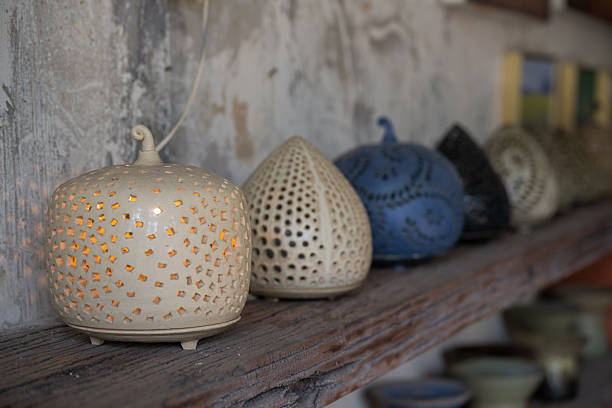 Traditional pottery workshop interior with handmade ceramic bowls and cups