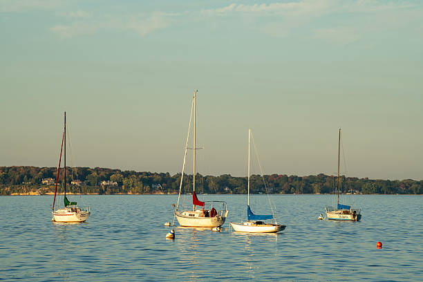 Wooden fishing boat on the river in autumn.