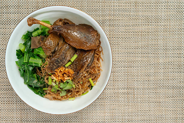 Eating Egg Noodles with Roasted Duck - Bangkok Street food.