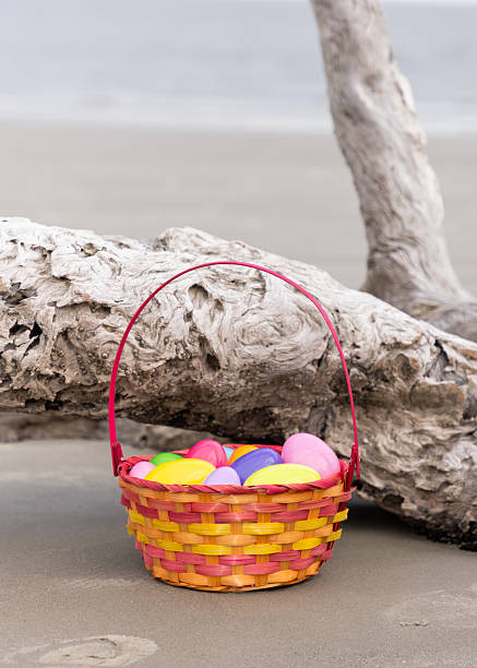 High angle view of an assortment of tin foil covered chocolate easter eggs in grass outdoors