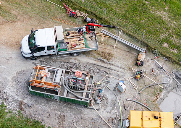 Drilling holes into road surface