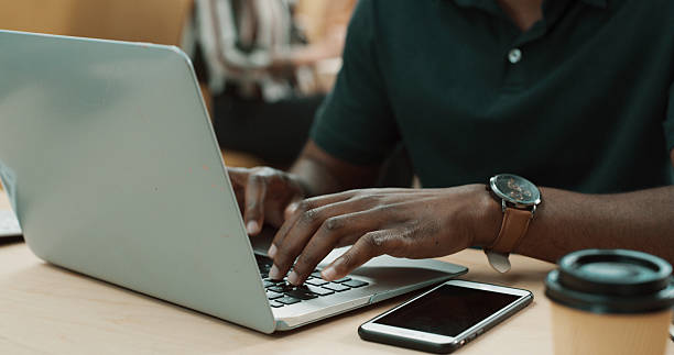istock Hands, person and typing on laptop in office for research, writing article and editing draft. Journalist, keyboard and pc for proofreading, report news and headline information for publication agenda 2260235823