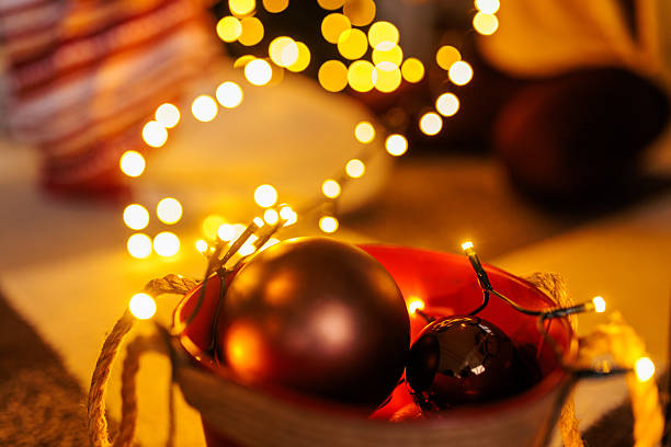 Closeup of an isolated orange vase with christmas deco