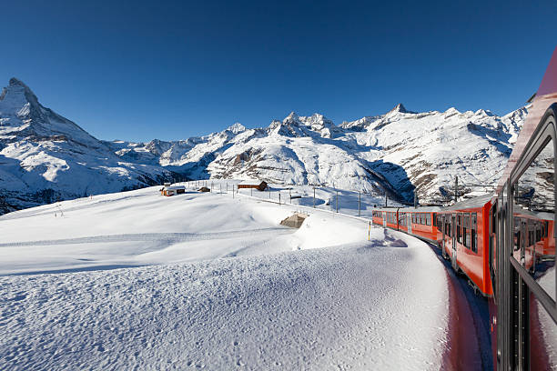 istock Gornergrat railway train with Matterhorn in winter, Swiss Alps 2260259041