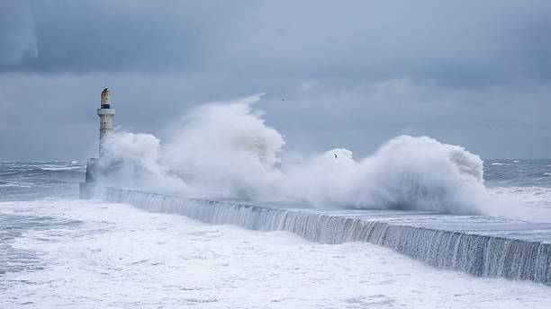 North Sea waves breaking against the wall at the entrance to Aberdeen Harbour, Scotland during February 2026.