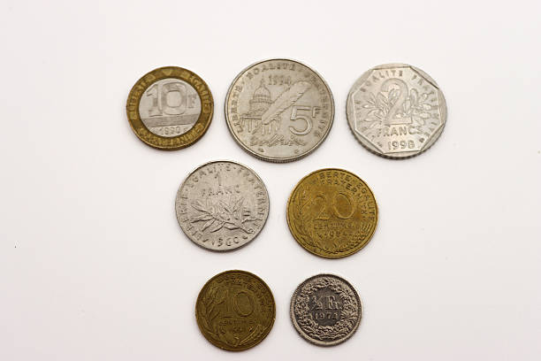 High resolution image of a vintage European  old coins, arranged on a clean white background. Concept of money, finance, economy, savings, inflation, historical currency and obsolete monetary systems. Flat lay composition with neutral lighting, suitable for commercial and editorial use.