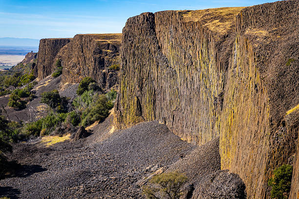 Scenic view of Phantom Falls canyon landscape in California with rugged cliffs, flowing waterfall, and natural rock formations in daylight